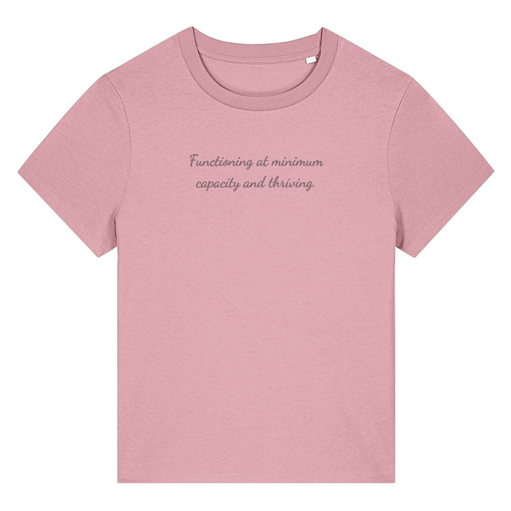 Pink organic cotton women's t-shirt featuring the funny quote ‘Functioning At Minimum Capacity And Thriving.’ by Rivaex Clothing