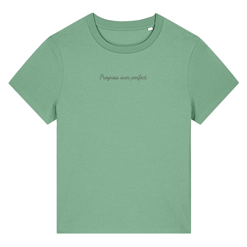 Green organic cotton women's t-shirt featuring the motivational quote ‘Progress Over Perfect.’ by Rivaex Clothing