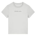 White organic cotton women's t-shirt featuring the motivational quote ‘She Builds in Silence.’ by Rivaex Clothing